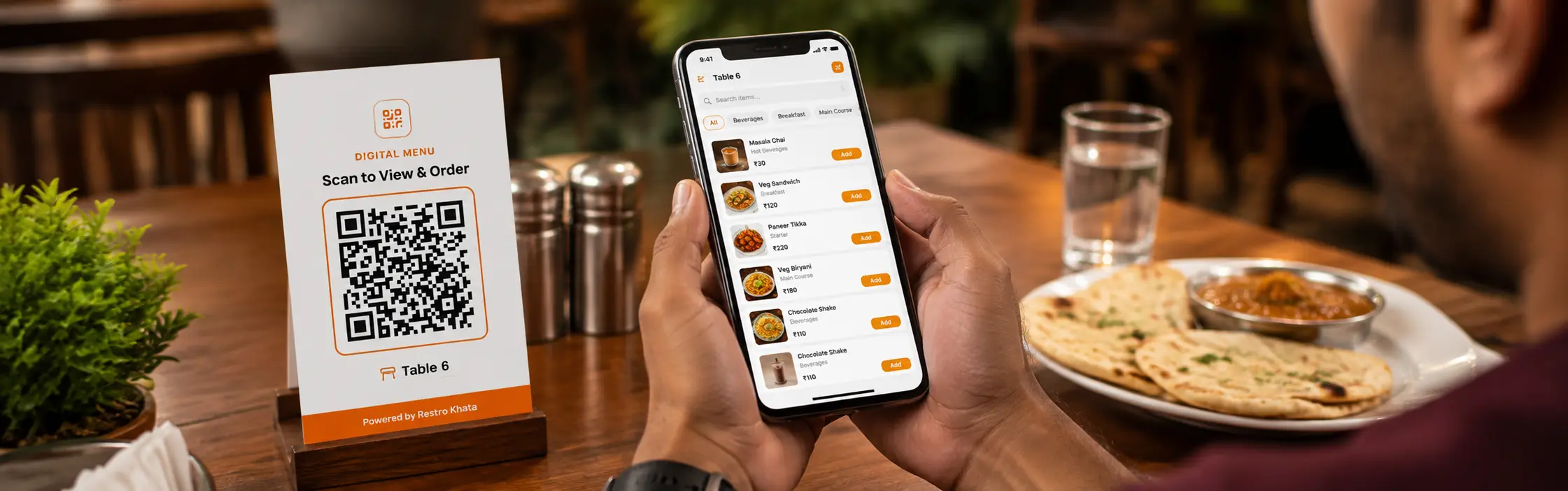 Customer scanning a digital QR menu system on restaurant table using mobile phone